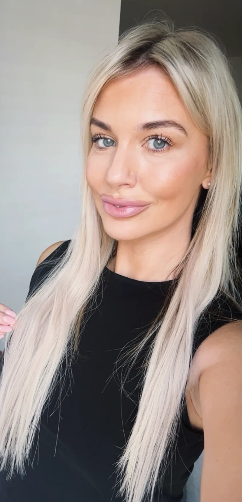 Lucy, a life coach, in a black top
